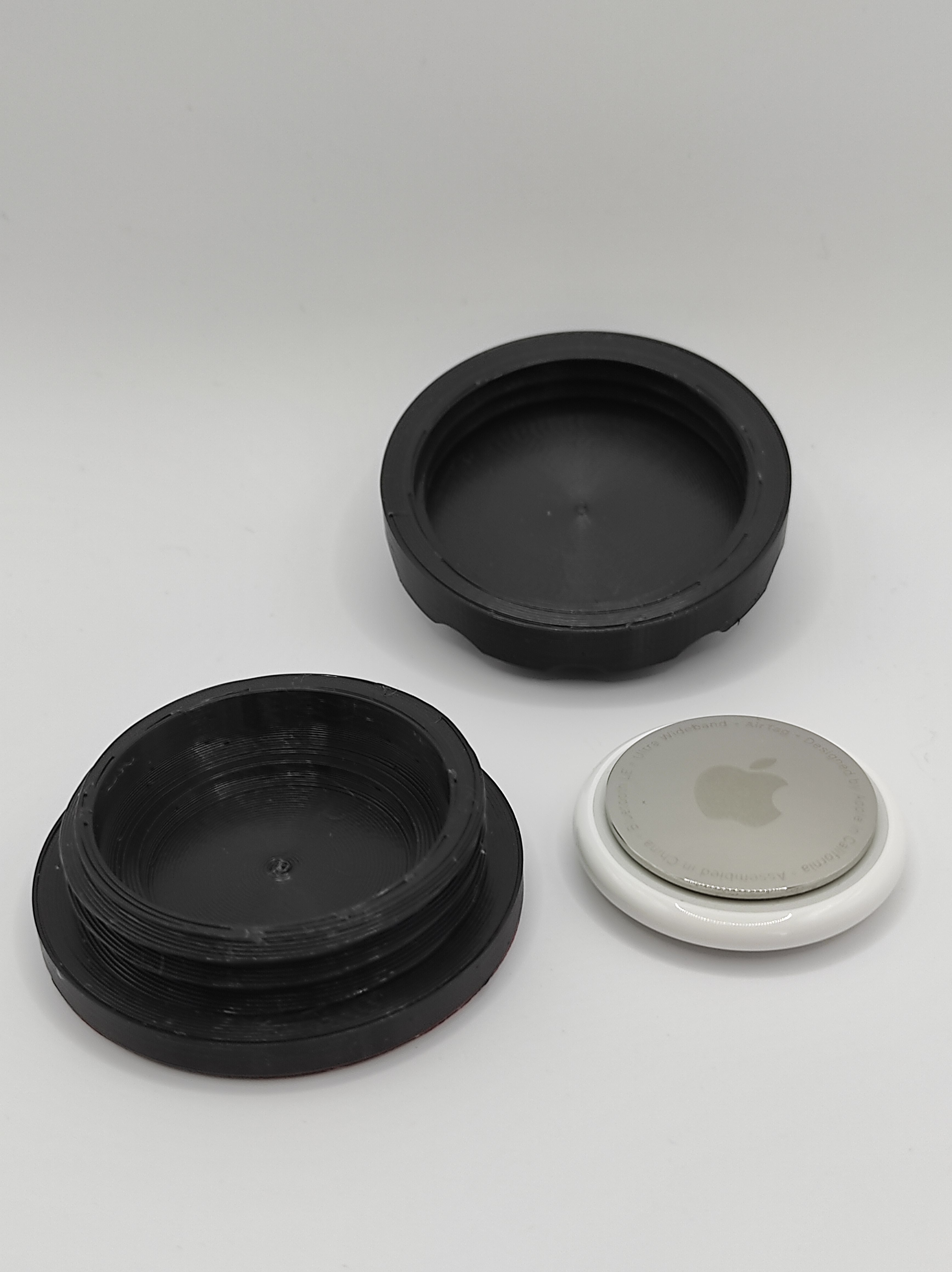 Apple Airtag next to ToolTag