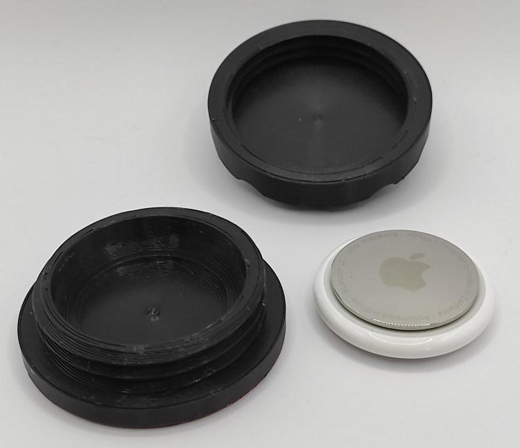 ToolTag open with AirTag next to it