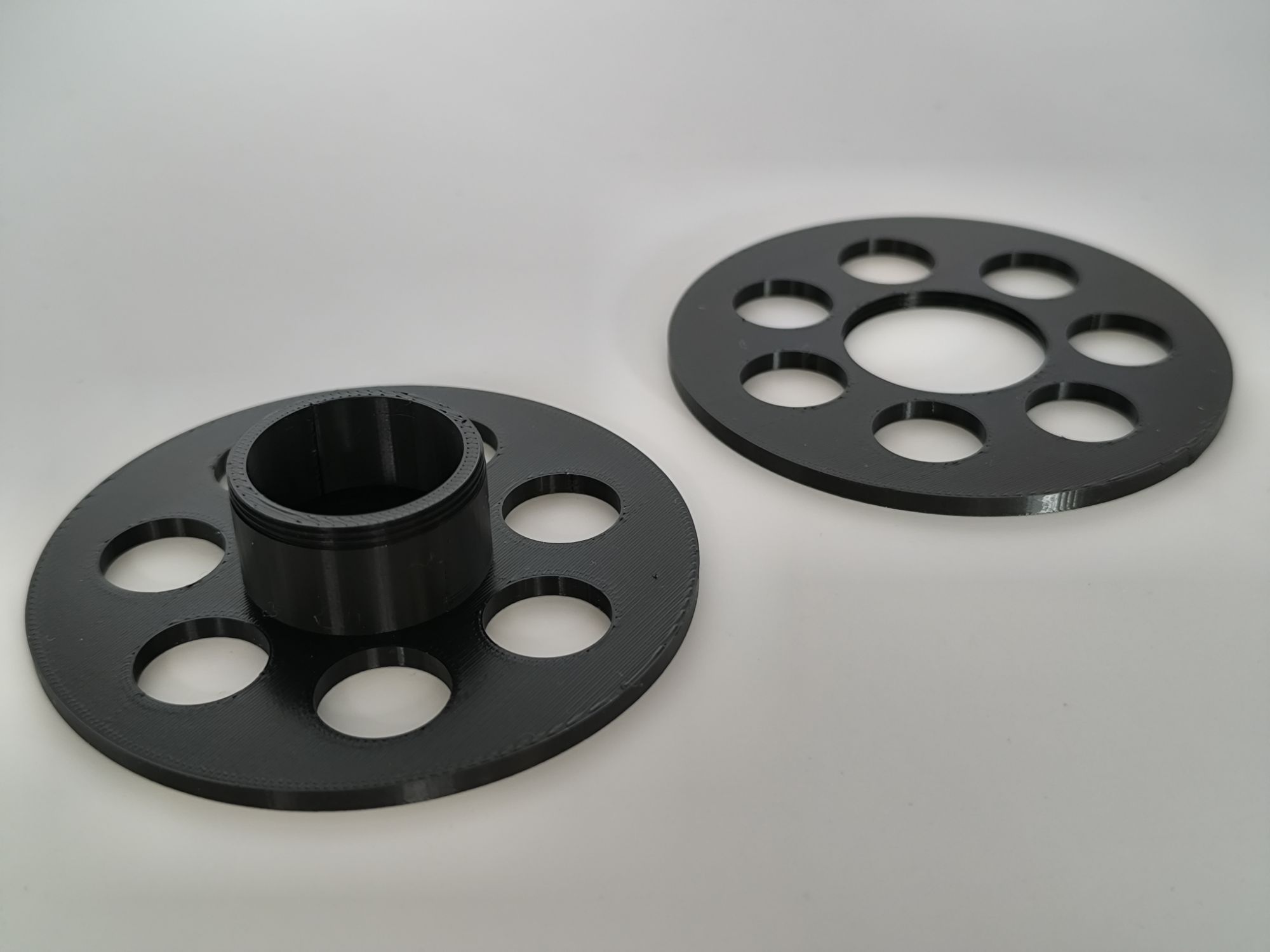 3D Printed fishing line holding reel with unscrewed into 2 pieces.